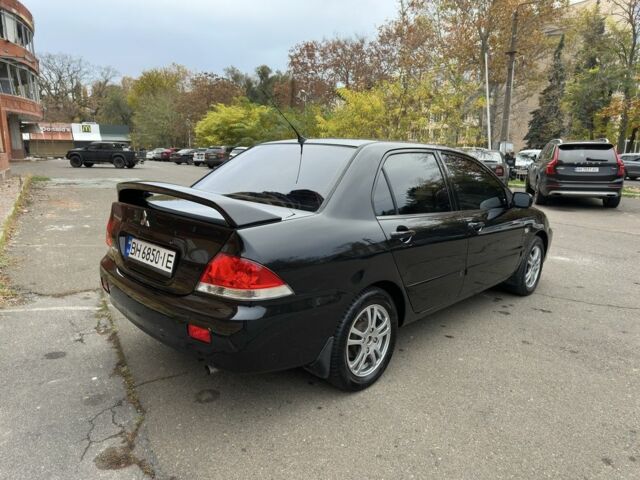 Черный Мицубиси Лансер, объемом двигателя 1.6 л и пробегом 173 тыс. км за 4700 $, фото 4 на Automoto.ua