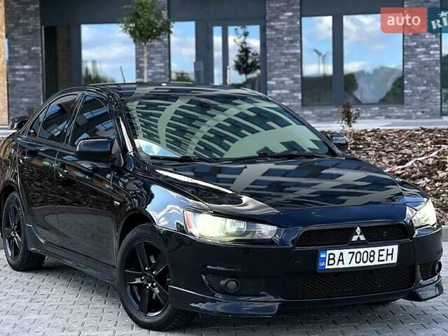 Черный Мицубиси Лансер, объемом двигателя 2 л и пробегом 205 тыс. км за 6500 $, фото 4 на Automoto.ua