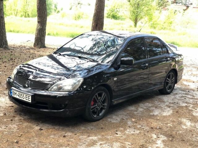 Чорний Міцубісі Lancer, об'ємом двигуна 2 л та пробігом 170 тис. км за 5650 $, фото 1 на Automoto.ua