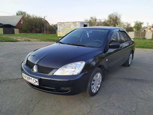 Черный Мицубиси Лансер, объемом двигателя 1.6 л и пробегом 32 тыс. км за 9000 $, фото 5 на Automoto.ua