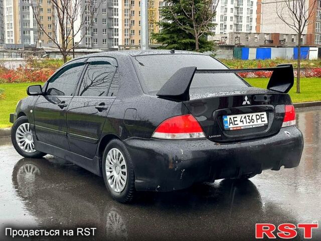 Чорний Міцубісі Lancer, об'ємом двигуна 1.6 л та пробігом 196 тис. км за 3900 $, фото 3 на Automoto.ua