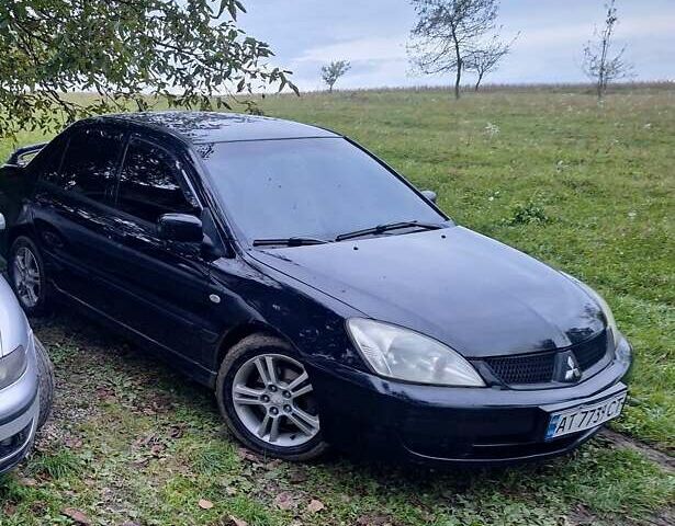 Черный Мицубиси Лансер, объемом двигателя 2 л и пробегом 300 тыс. км за 3200 $, фото 11 на Automoto.ua