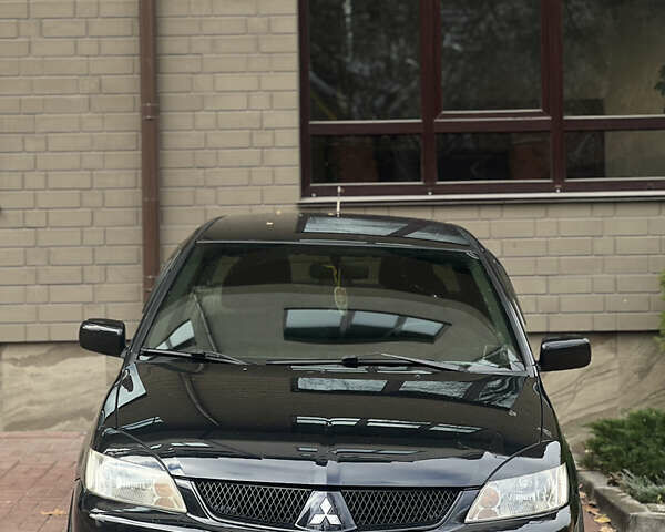 Черный Мицубиси Лансер, объемом двигателя 1.6 л и пробегом 211 тыс. км за 5700 $, фото 6 на Automoto.ua