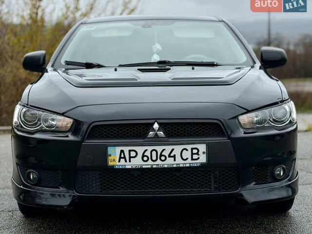 Черный Мицубиси Лансер, объемом двигателя 2 л и пробегом 215 тыс. км за 5500 $, фото 3 на Automoto.ua