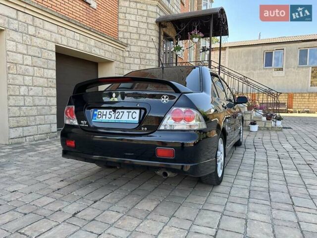 Черный Мицубиси Лансер, объемом двигателя 2 л и пробегом 272 тыс. км за 5514 $, фото 2 на Automoto.ua