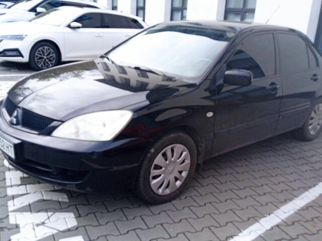 Черный Мицубиси Лансер, объемом двигателя 1.6 л и пробегом 223 тыс. км за 4300 $, фото 6 на Automoto.ua