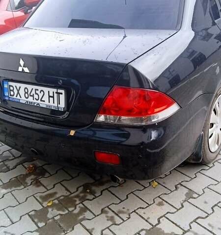 Черный Мицубиси Лансер, объемом двигателя 1.6 л и пробегом 223 тыс. км за 4300 $, фото 6 на Automoto.ua