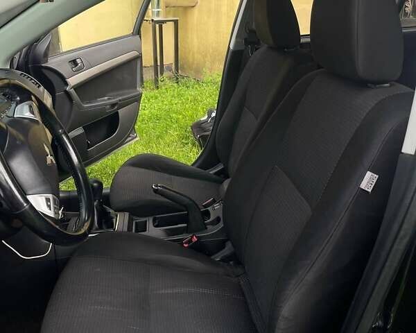 Чорний Міцубісі Lancer, об'ємом двигуна 2 л та пробігом 207 тис. км за 6500 $, фото 2 на Automoto.ua
