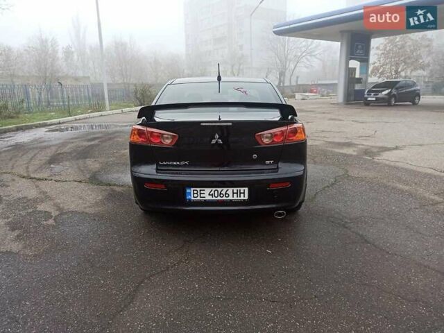 Черный Мицубиси Лансер, объемом двигателя 2 л и пробегом 195 тыс. км за 7899 $, фото 5 на Automoto.ua