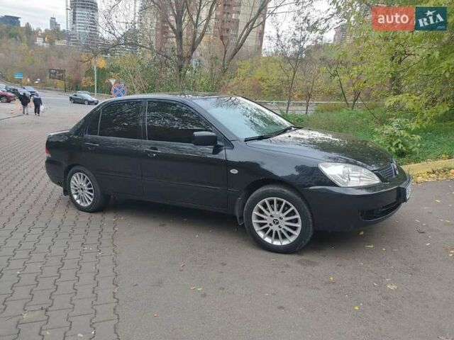 Чорний Міцубісі Lancer, об'ємом двигуна 1.58 л та пробігом 190 тис. км за 3750 $, фото 19 на Automoto.ua