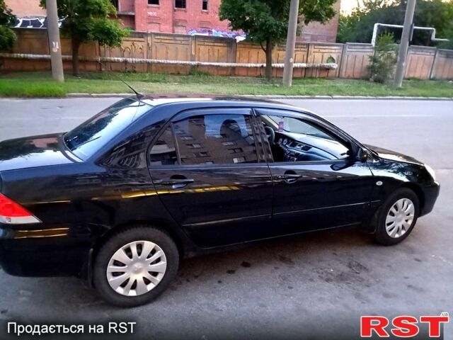 Черный Мицубиси Лансер, объемом двигателя 1.6 л и пробегом 247 тыс. км за 4000 $, фото 5 на Automoto.ua