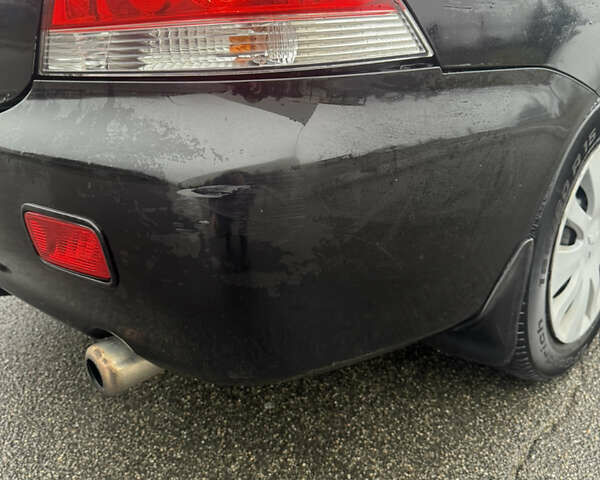 Чорний Міцубісі Lancer, об'ємом двигуна 1.58 л та пробігом 256 тис. км за 3700 $, фото 35 на Automoto.ua