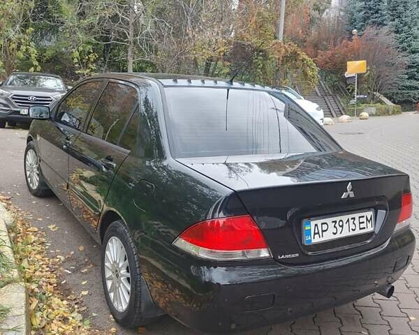 Чорний Міцубісі Lancer, об'ємом двигуна 1.58 л та пробігом 190 тис. км за 3750 $, фото 23 на Automoto.ua