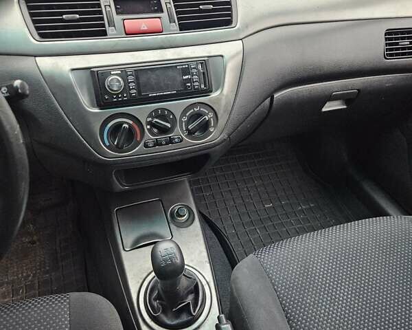 Черный Мицубиси Лансер, объемом двигателя 1.6 л и пробегом 152 тыс. км за 4999 $, фото 8 на Automoto.ua