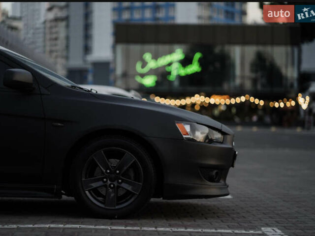 Чорний Міцубісі Lancer, об'ємом двигуна 2 л та пробігом 203 тис. км за 7000 $, фото 31 на Automoto.ua