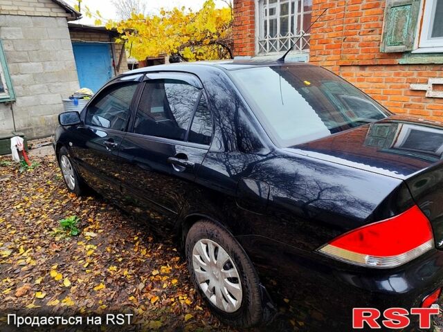 Черный Мицубиси Лансер, объемом двигателя 1.6 л и пробегом 171 тыс. км за 4350 $, фото 3 на Automoto.ua