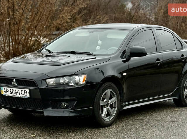 Черный Мицубиси Лансер, объемом двигателя 2 л и пробегом 215 тыс. км за 5500 $, фото 1 на Automoto.ua