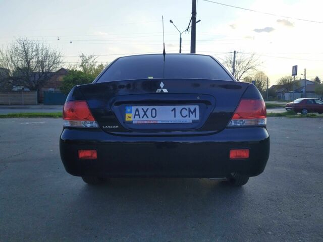 Черный Мицубиси Лансер, объемом двигателя 1.6 л и пробегом 32 тыс. км за 9000 $, фото 17 на Automoto.ua