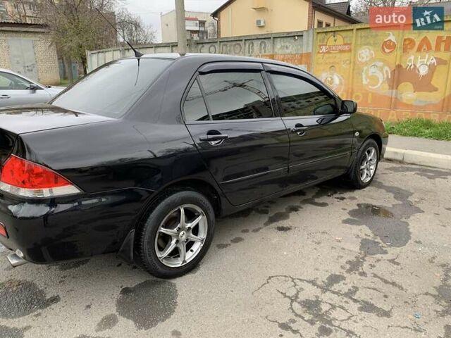 Черный Мицубиси Лансер, объемом двигателя 1.6 л и пробегом 164 тыс. км за 5200 $, фото 6 на Automoto.ua