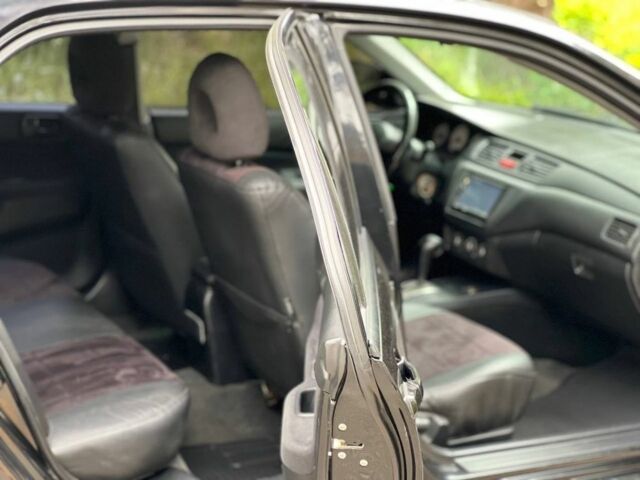 Чорний Міцубісі Lancer, об'ємом двигуна 1.6 л та пробігом 245 тис. км за 4700 $, фото 15 на Automoto.ua
