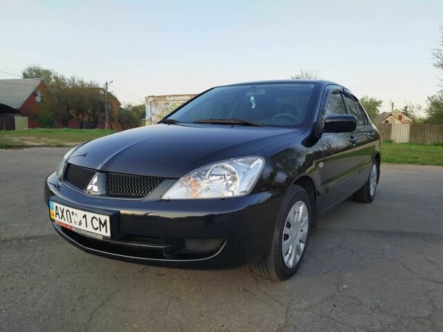 Черный Мицубиси Лансер, объемом двигателя 1.6 л и пробегом 32 тыс. км за 9000 $, фото 9 на Automoto.ua