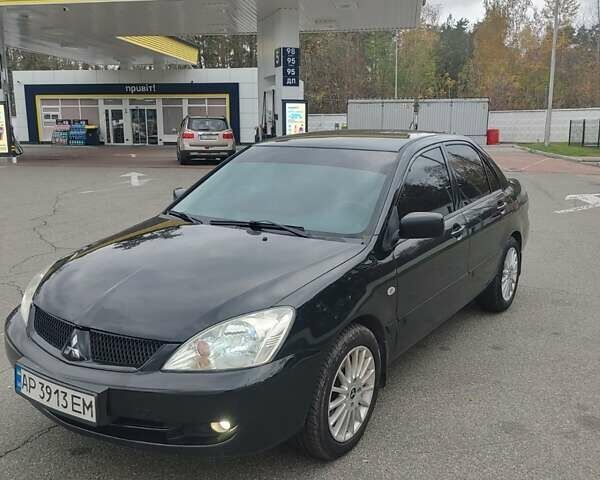 Чорний Міцубісі Lancer, об'ємом двигуна 1.58 л та пробігом 190 тис. км за 3750 $, фото 1 на Automoto.ua
