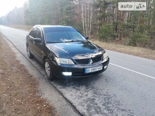 Чорний Міцубісі Lancer, об'ємом двигуна 1.58 л та пробігом 210 тис. км за 4200 $, фото 1 на Automoto.ua