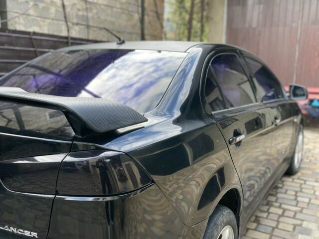 Чорний Міцубісі Lancer, об'ємом двигуна 2 л та пробігом 175 тис. км за 6500 $, фото 5 на Automoto.ua