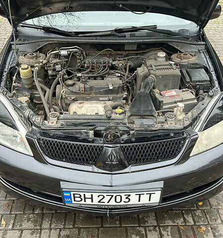 Чорний Міцубісі Lancer, об'ємом двигуна 1.59 л та пробігом 300 тис. км за 3400 $, фото 3 на Automoto.ua