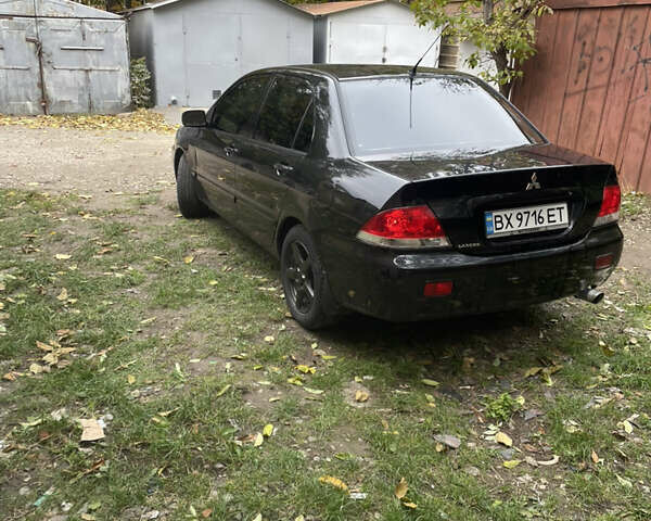 Черный Мицубиси Лансер, объемом двигателя 1.6 л и пробегом 258 тыс. км за 2999 $, фото 3 на Automoto.ua