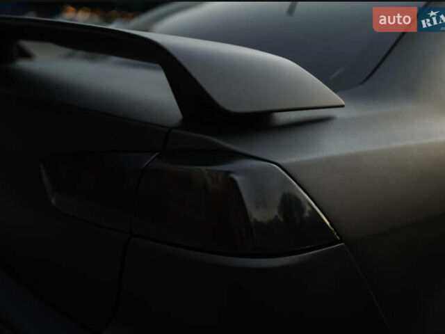 Чорний Міцубісі Lancer, об'ємом двигуна 2 л та пробігом 203 тис. км за 7000 $, фото 26 на Automoto.ua