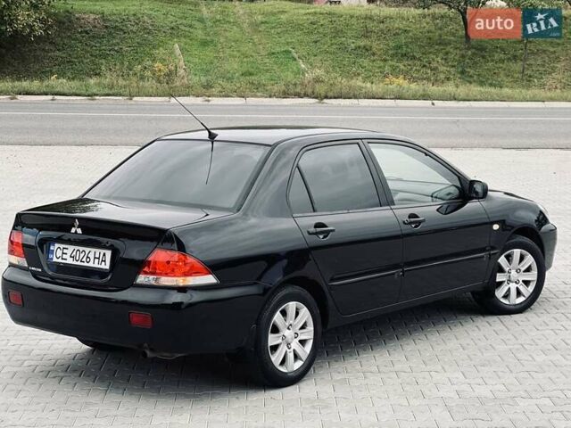 Чорний Міцубісі Lancer, об'ємом двигуна 1.6 л та пробігом 243 тис. км за 4950 $, фото 22 на Automoto.ua