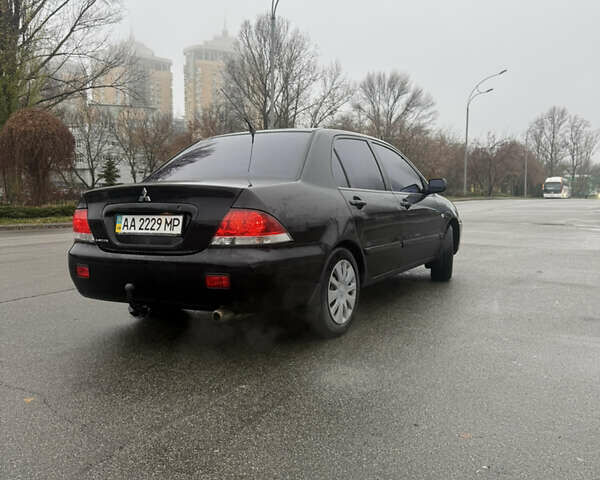 Чорний Міцубісі Lancer, об'ємом двигуна 1.58 л та пробігом 256 тис. км за 3700 $, фото 5 на Automoto.ua