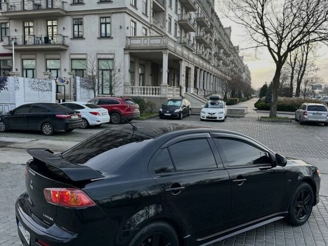 Черный Мицубиси Лансер, объемом двигателя 2 л и пробегом 242 тыс. км за 6200 $, фото 12 на Automoto.ua