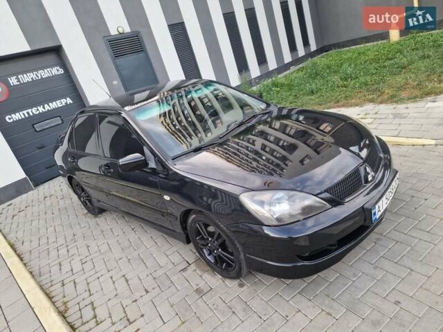 Чорний Міцубісі Lancer, об'ємом двигуна 2 л та пробігом 272 тис. км за 4750 $, фото 6 на Automoto.ua