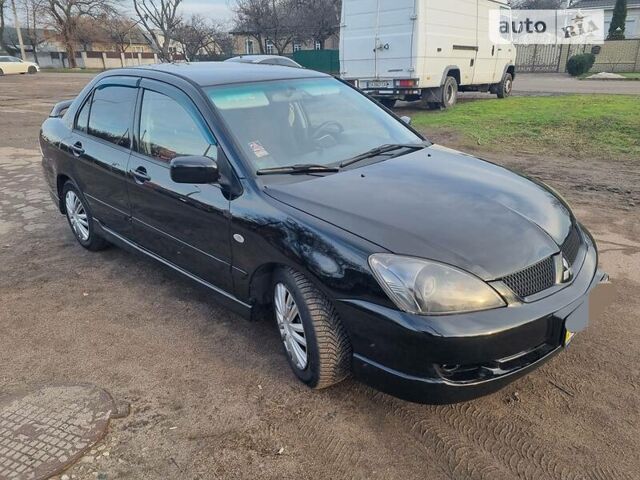 Чорний Міцубісі Lancer, об'ємом двигуна 2 л та пробігом 187 тис. км за 4800 $, фото 3 на Automoto.ua