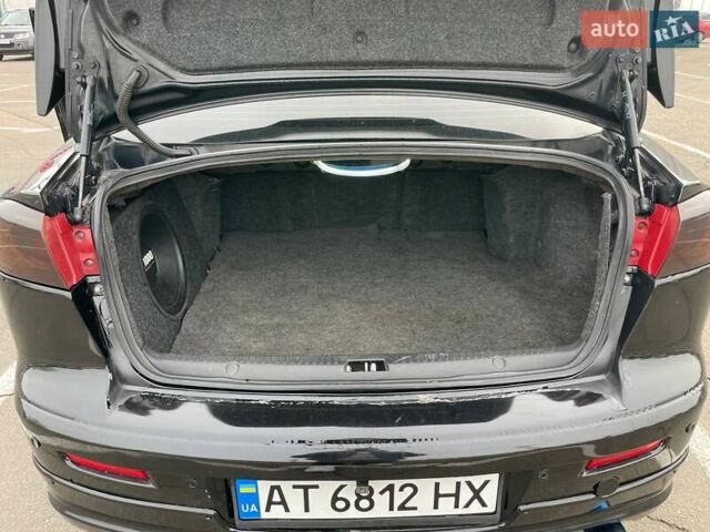 Черный Мицубиси Лансер, объемом двигателя 2 л и пробегом 246 тыс. км за 7500 $, фото 21 на Automoto.ua