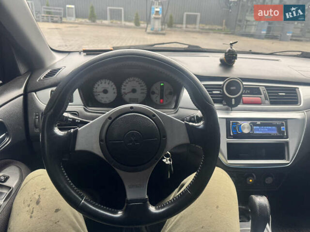 Чорний Міцубісі Lancer, об'ємом двигуна 2 л та пробігом 210 тис. км за 5500 $, фото 52 на Automoto.ua