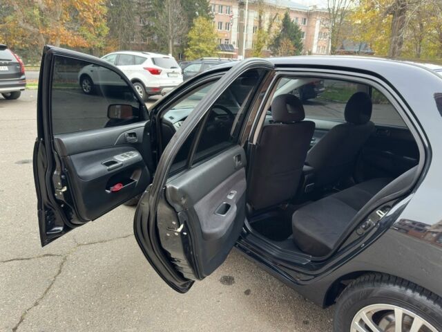 Черный Мицубиси Лансер, объемом двигателя 1.6 л и пробегом 173 тыс. км за 4700 $, фото 10 на Automoto.ua