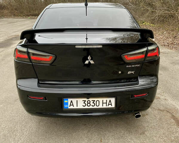 Черный Мицубиси Лансер, объемом двигателя 2 л и пробегом 164 тыс. км за 8300 $, фото 13 на Automoto.ua