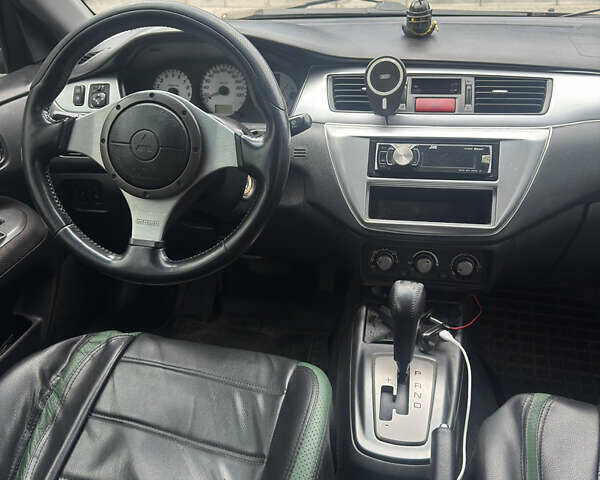 Чорний Міцубісі Lancer, об'ємом двигуна 2 л та пробігом 210 тис. км за 5500 $, фото 41 на Automoto.ua