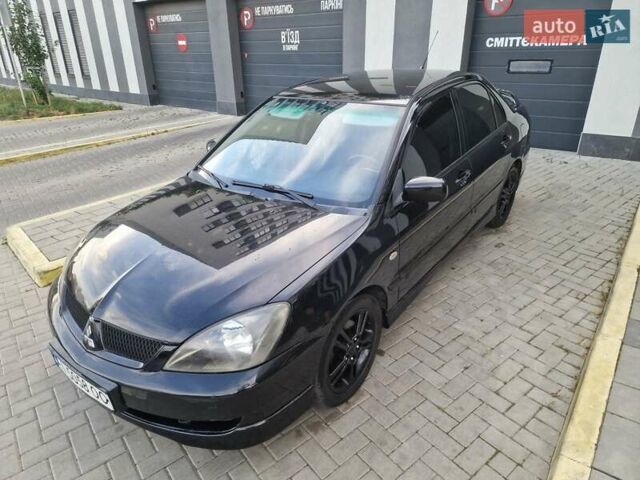 Чорний Міцубісі Lancer, об'ємом двигуна 2 л та пробігом 272 тис. км за 4750 $, фото 1 на Automoto.ua