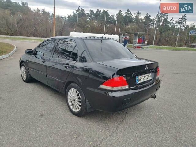 Чорний Міцубісі Lancer, об'ємом двигуна 1.58 л та пробігом 190 тис. км за 3750 $, фото 4 на Automoto.ua