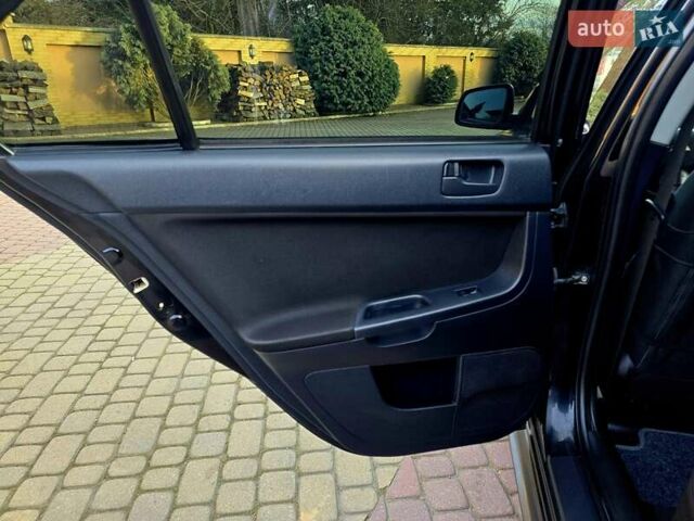 Чорний Міцубісі Lancer, об'ємом двигуна 2 л та пробігом 260 тис. км за 6555 $, фото 29 на Automoto.ua