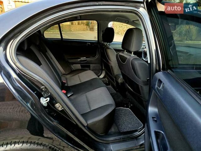 Чорний Міцубісі Lancer, об'ємом двигуна 2 л та пробігом 260 тис. км за 6555 $, фото 42 на Automoto.ua