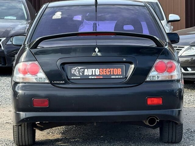 Черный Мицубиси Лансер, объемом двигателя 1.6 л и пробегом 260 тыс. км за 3700 $, фото 2 на Automoto.ua