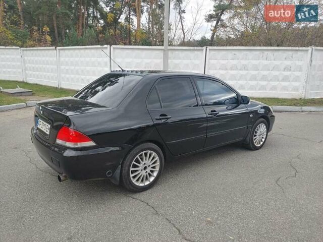 Чорний Міцубісі Lancer, об'ємом двигуна 1.58 л та пробігом 190 тис. км за 3750 $, фото 7 на Automoto.ua