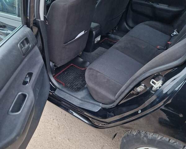 Чорний Міцубісі Lancer, об'ємом двигуна 1.6 л та пробігом 273 тис. км за 3999 $, фото 25 на Automoto.ua