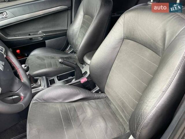 Черный Мицубиси Лансер, объемом двигателя 2 л и пробегом 246 тыс. км за 7500 $, фото 16 на Automoto.ua