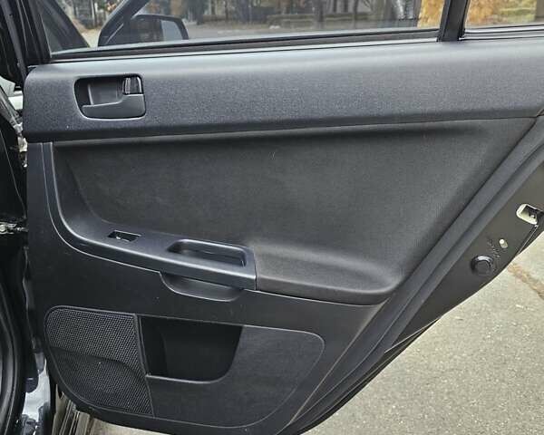 Міцубісі Lancer 2007 у Києві на Automoto.ua Чорний Міцубісі Lancer, об'ємом двигуна 2 л та пробігом 115 тис. км за 5000 $, фото 14 на Automoto.ua